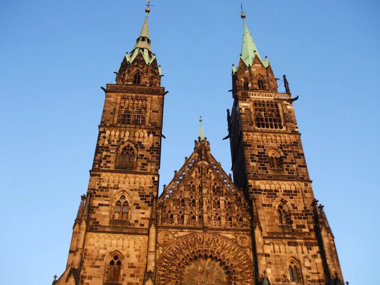 a large cathedral with two towers with crosses