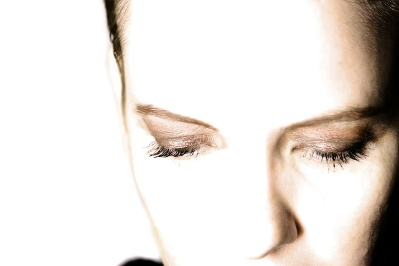 a close up of a woman with long lashes