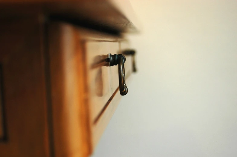 a close up view of a cabinet handle on a door