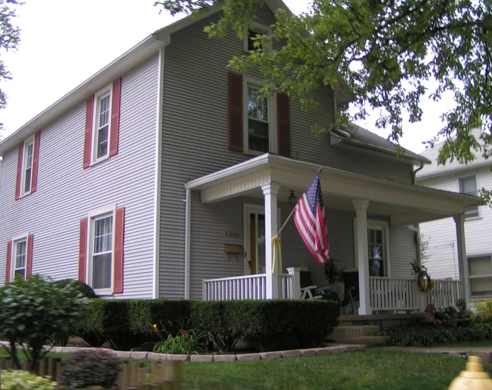 a flag in the yard of a house