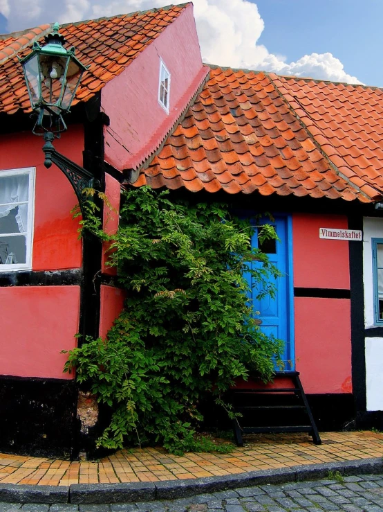 a red building has two doors on the outside