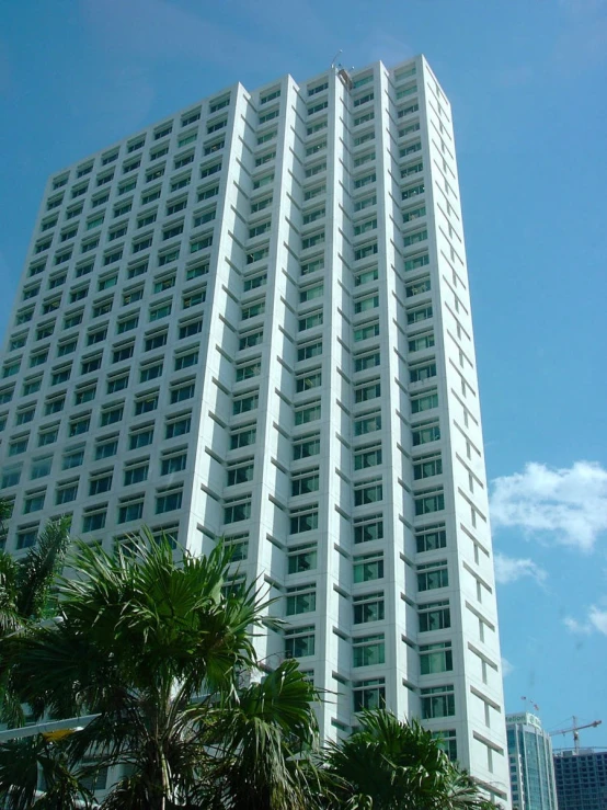 the front of a large tall white building
