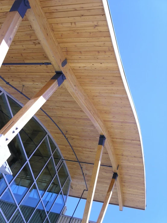 wooden structure with a window that has glass walls