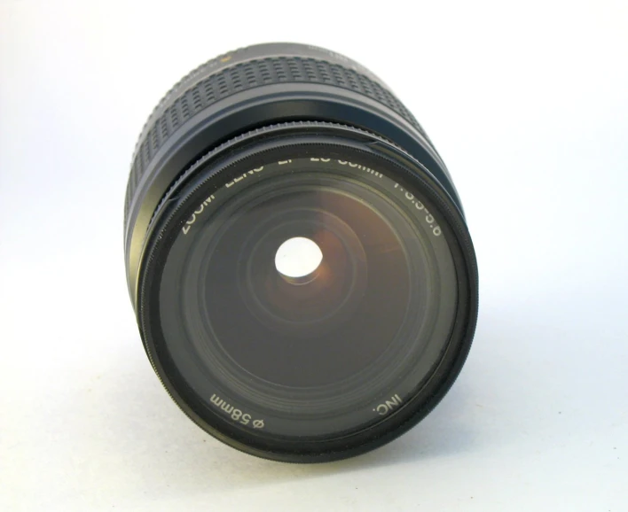 the lens is sitting on the table, which is open