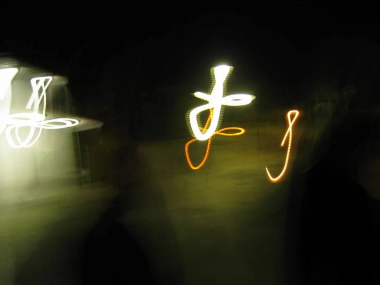 some blurry images of lights on a street