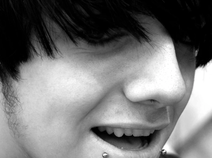 black and white po of a young woman with piercing on her nose