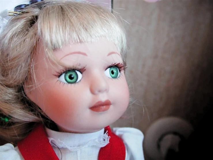 a doll with big eyes is looking at the camera