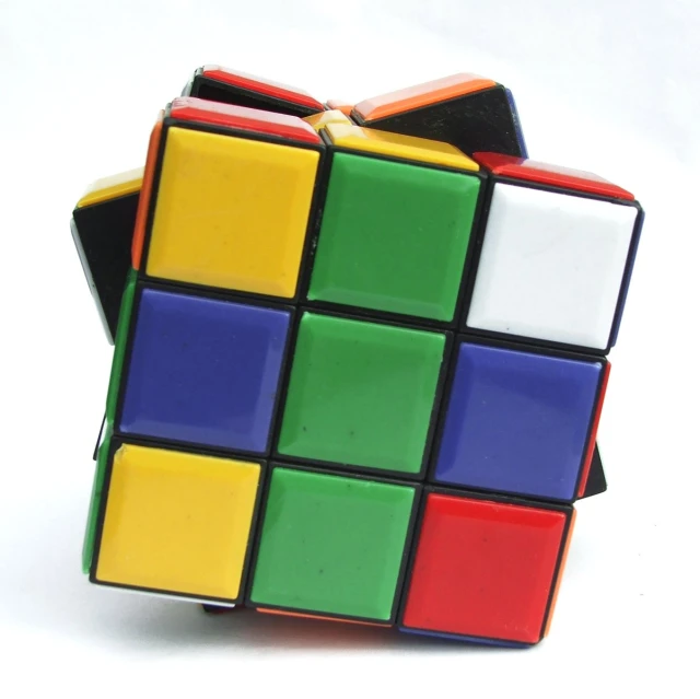 a colorful cube sitting in the center of a white background