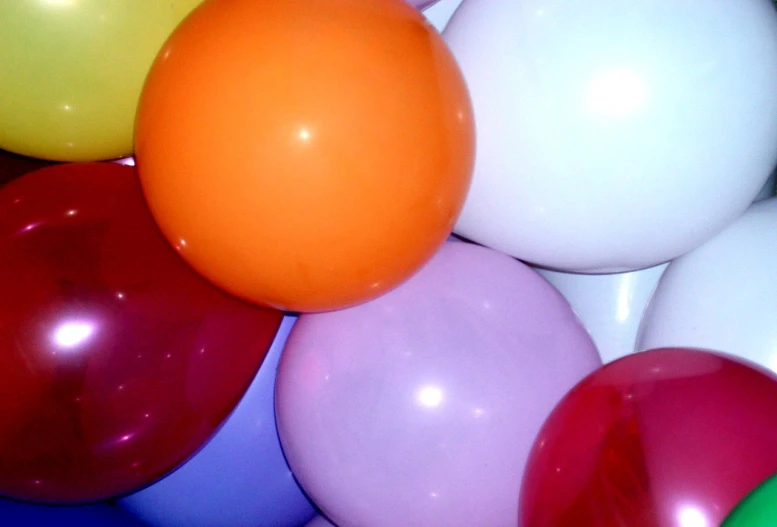 a group of balloon filled with white and red one