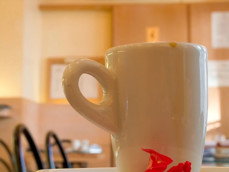 a large coffee cup that is on top of a saucer