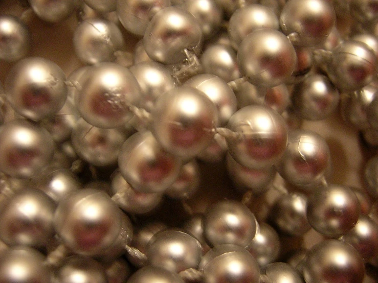 a pile of silver pearls are shown in this picture