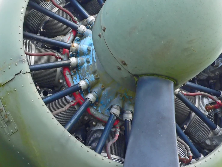 a large propeller on top of an airplane