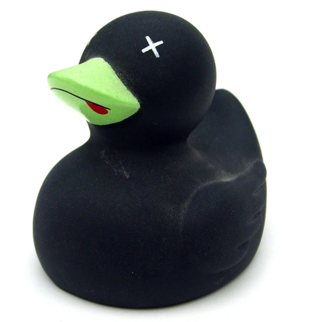 a black rubber toy with a green beak