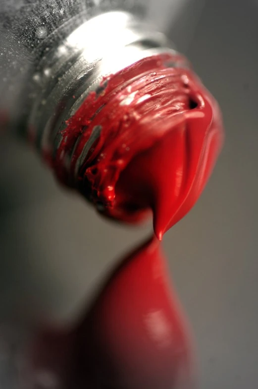 the top of an orange and silver liquid