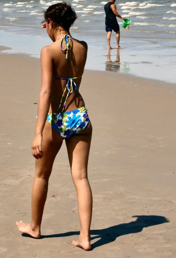 a woman in a bikini at the beach