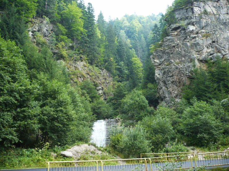 the blue road is driving past a cliff