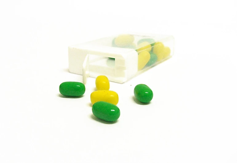 an image of some pills next to a case