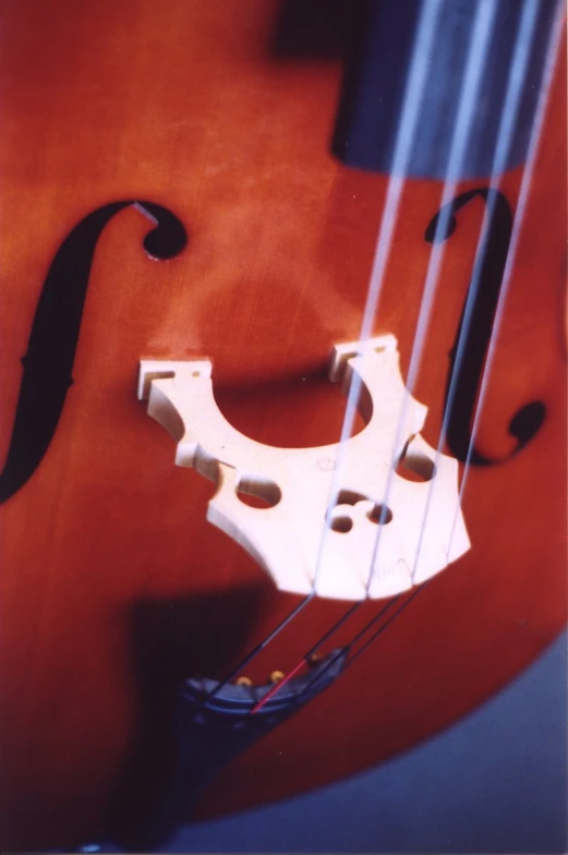 an old violin has been decorated with black and red lines