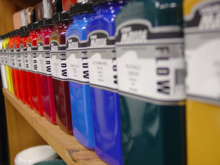 many different colors of bottled water are shown