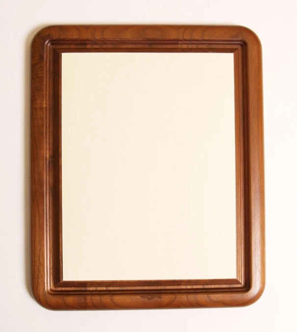 a square brown wooden frame holds a light tan wall