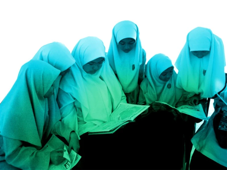 there are seven woman dressed in white standing together