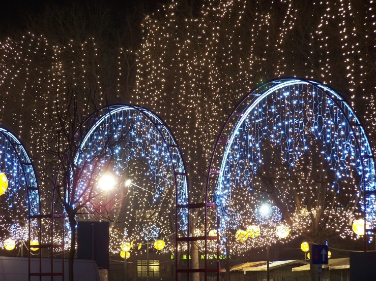 a large christmas display featuring lights in different shapes and colors