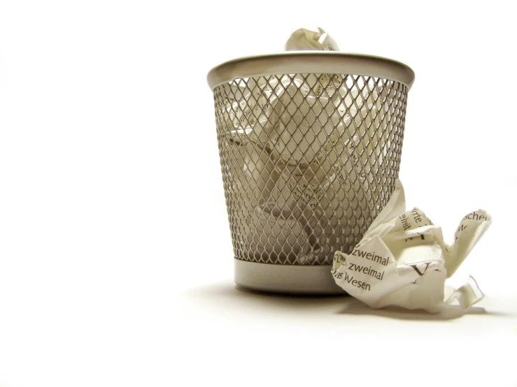 a coffee cup with a small white heart and tea bags on the side