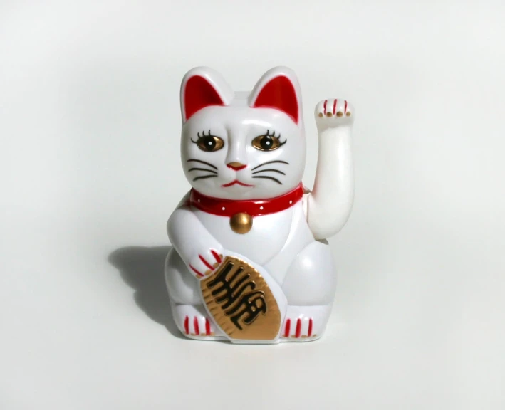 this is a picture of a white cat figurine