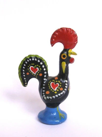 a rooster figurine made from polymer clay