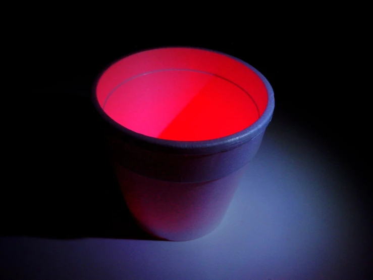 a plastic cup sitting on top of a table