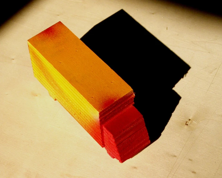 a row of yellow and red pieces of paper