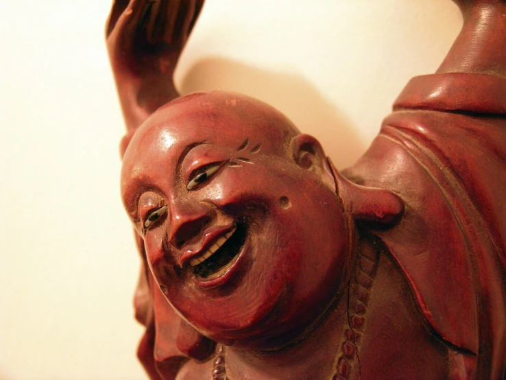 an asian statue with a woman smiling