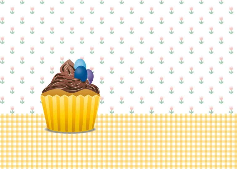 a large cupcake on top of a checkered surface