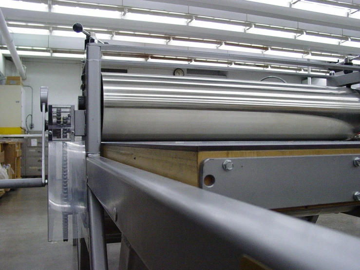 the back side of an assembly line with a machine behind it