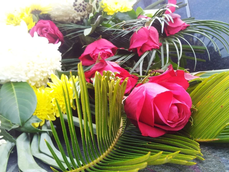 the bouquet of roses and foliage are ready to be sold