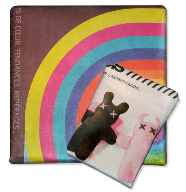 a spiral notebook with a dog picture and a rainbow background