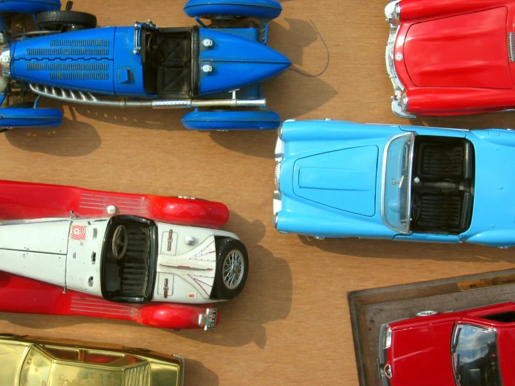 toy cars from above in various colors on a table