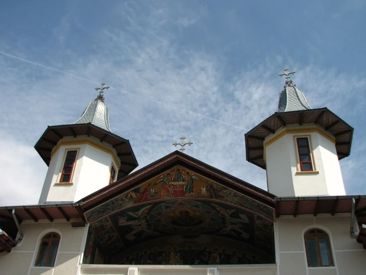 two high steeples on top of an ornate building