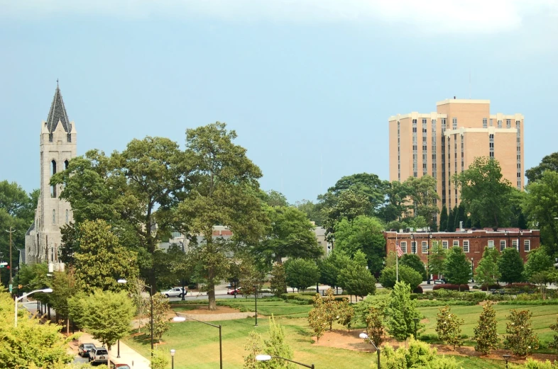 a cityscape with a clock tower in the distance