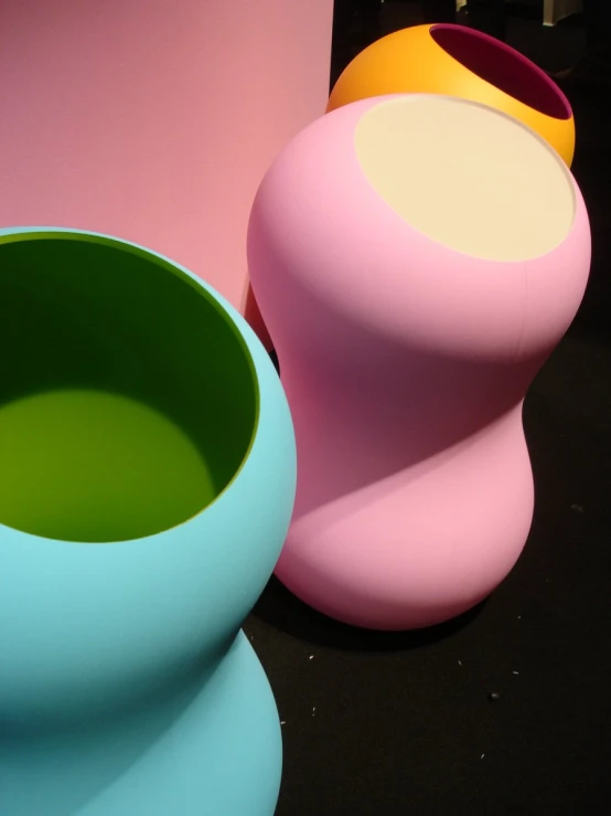 a group of brightly colored vases and vases for sale