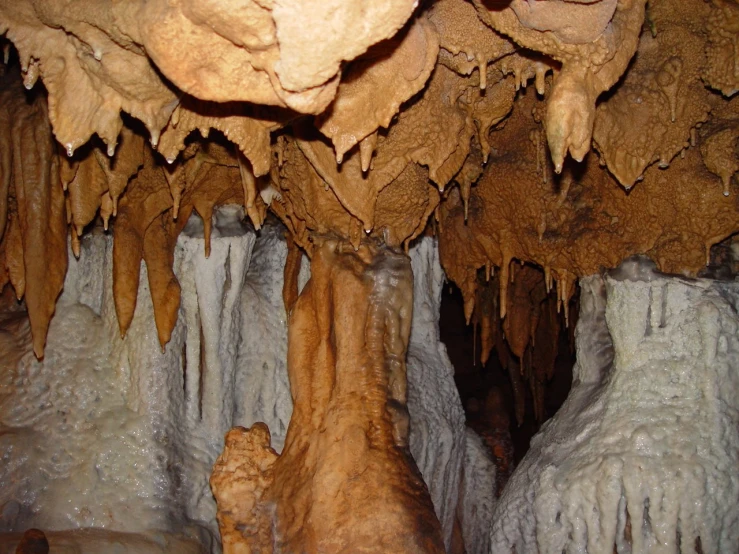 the inside of an ice cave with white formations