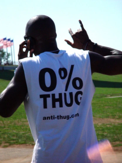 a guy on a cell phone with a message that says 90 % thug