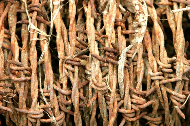 many metal rusted chains have been placed together