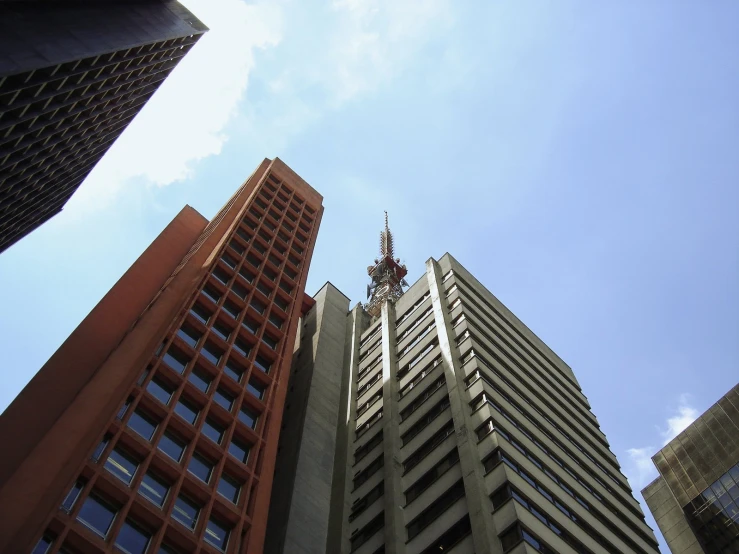 two very tall buildings on either side of a clock tower