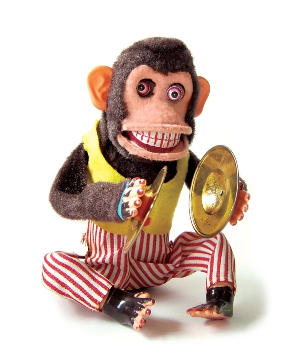 an action figure, monkey playing musical instruments