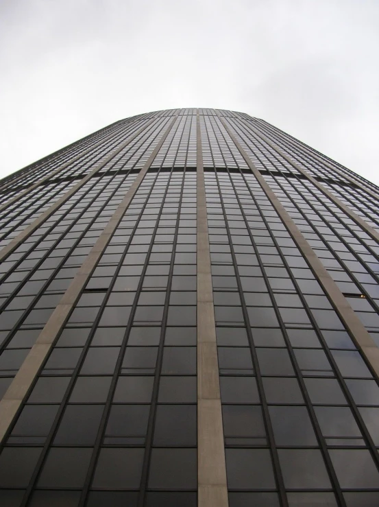 a large skyscr in front of a very gray sky