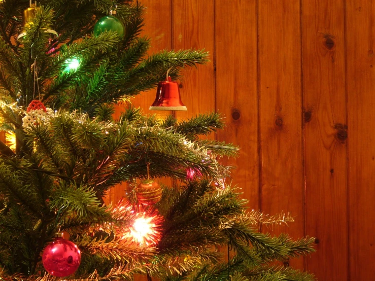 a christmas tree with an ornament on it