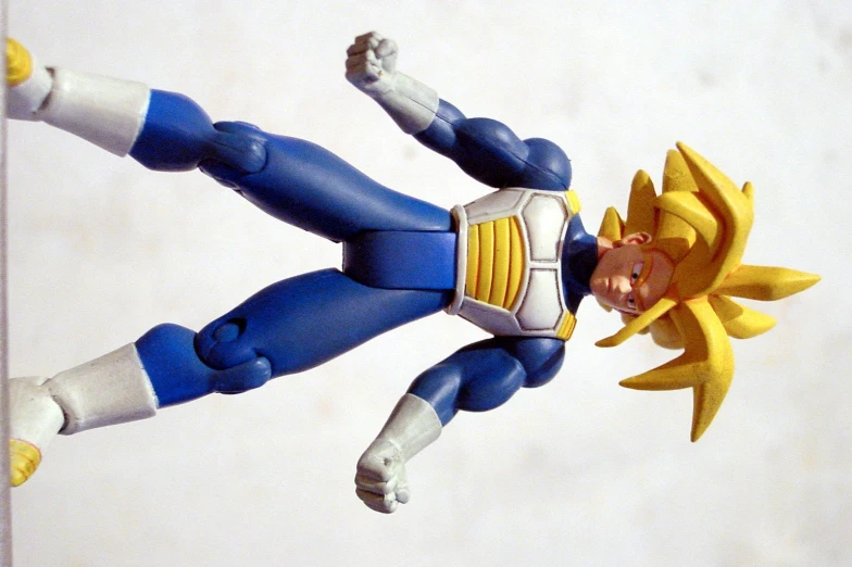 a blue action figure wearing yellow and black