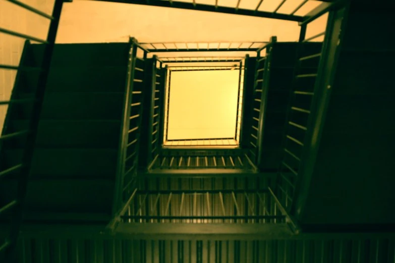 light above a row of metal crates in a warehouse