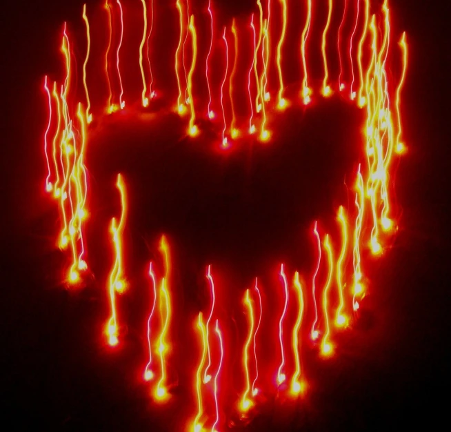 a lit up heart is seen in this image